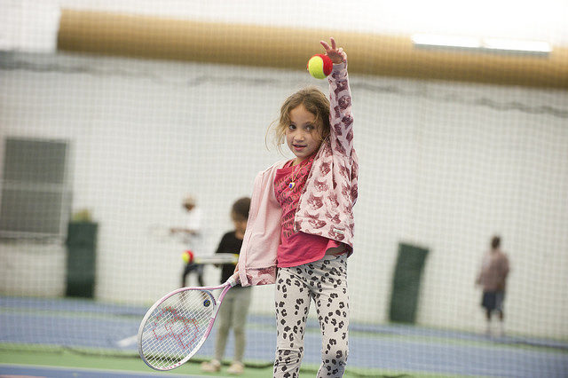 Young tennis enthusiast learning the game at Pauline Betz Addie Tennis Center Open House 