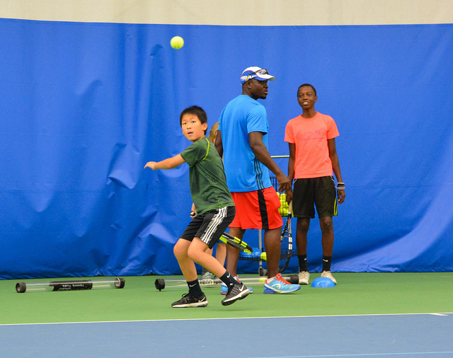 kids practicing tennis
