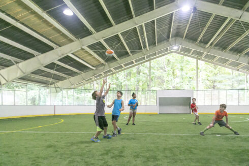 Children playing football at Wheaton Sports Pavilion