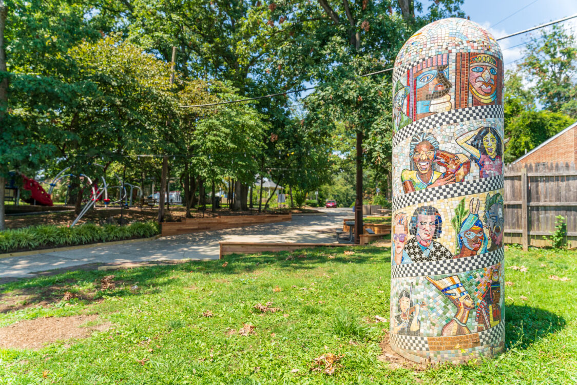 “Faces of Flower Avenue” was created by artist George Fishman. It is a porcelain and glass tile totem pole at Flower Avenue Urban Park