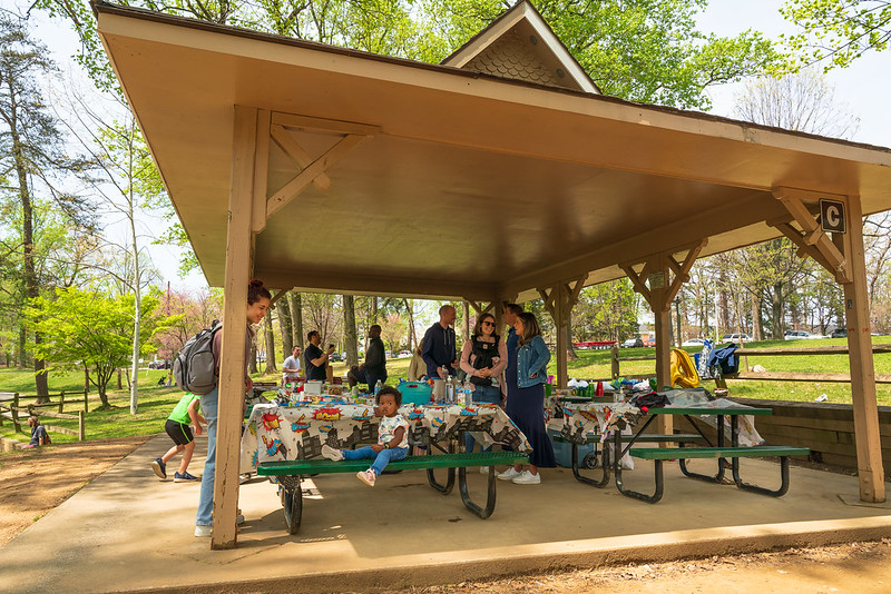 Group standing in a Wheaton Regional Park Picnic Shelter