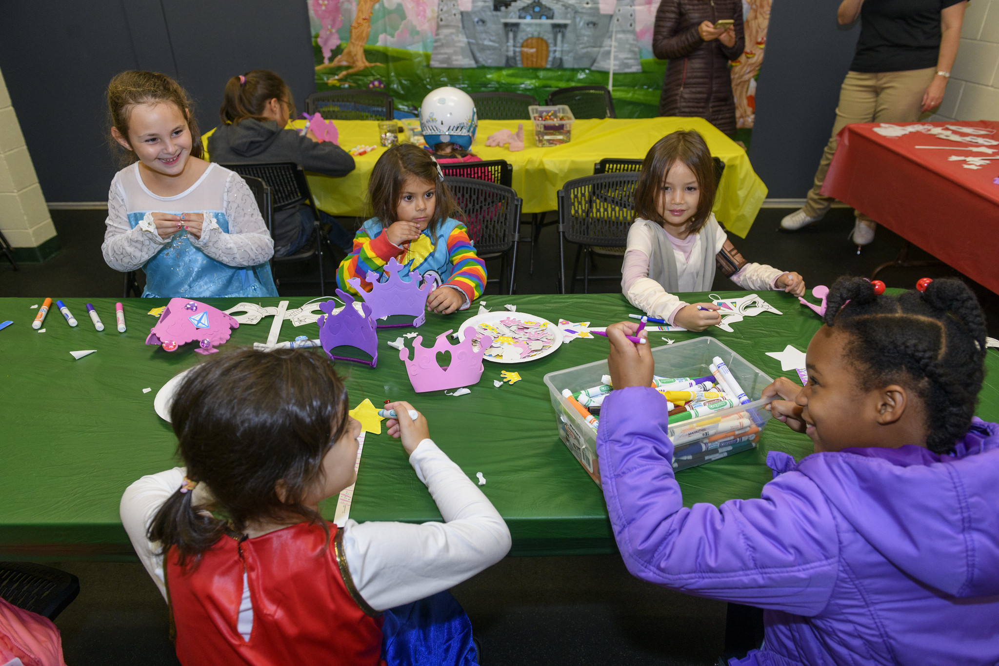children doing crafts at a table