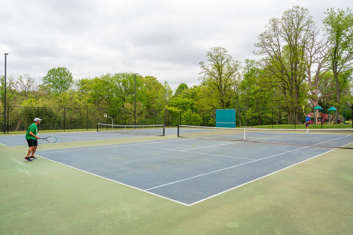 players on tennis court at Quince Orchard Knolls Local Park