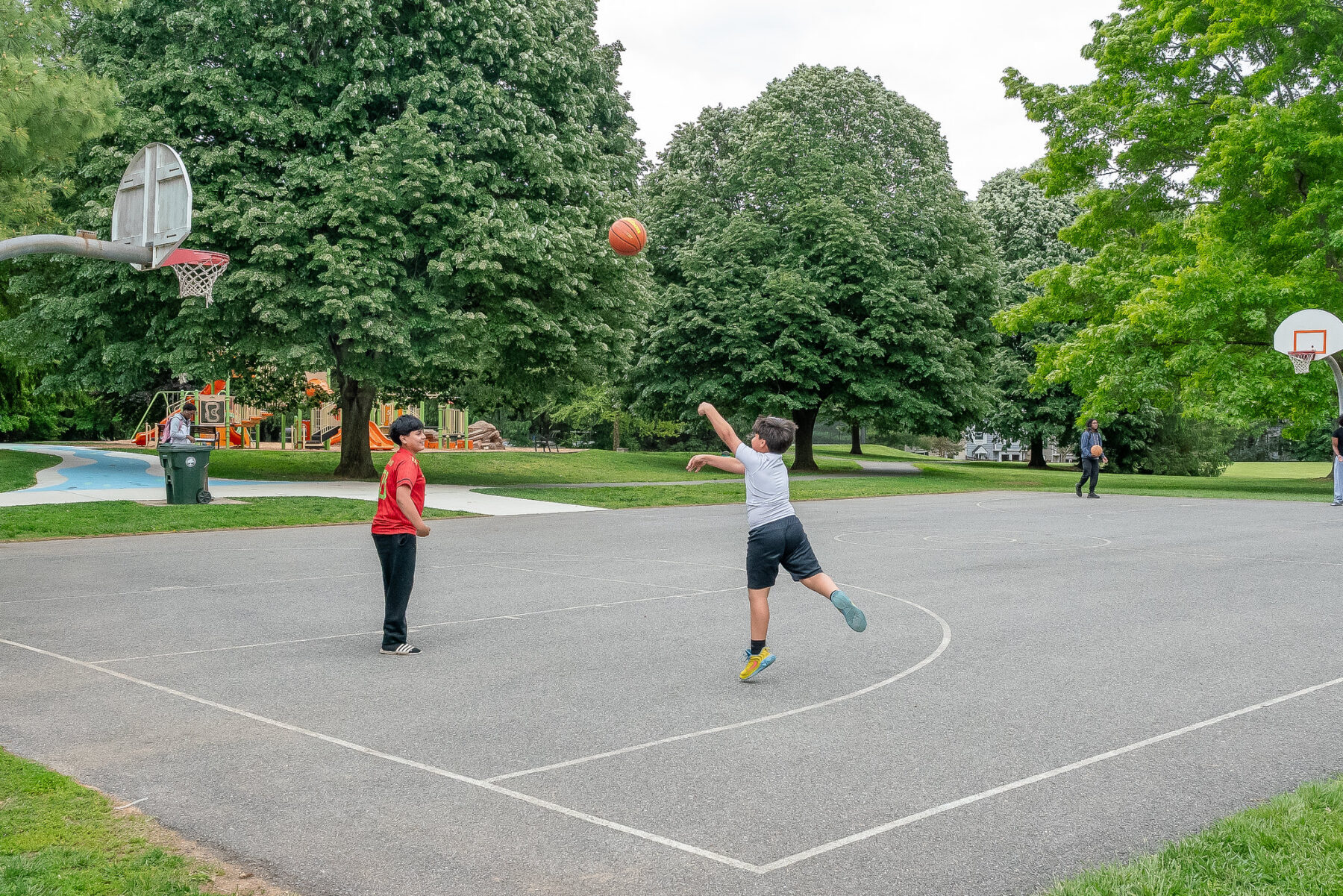 Children playing basketball at Waters Landing.