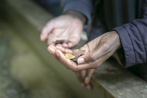Guest showing arrowheads found while using the Gem Mining Sluice