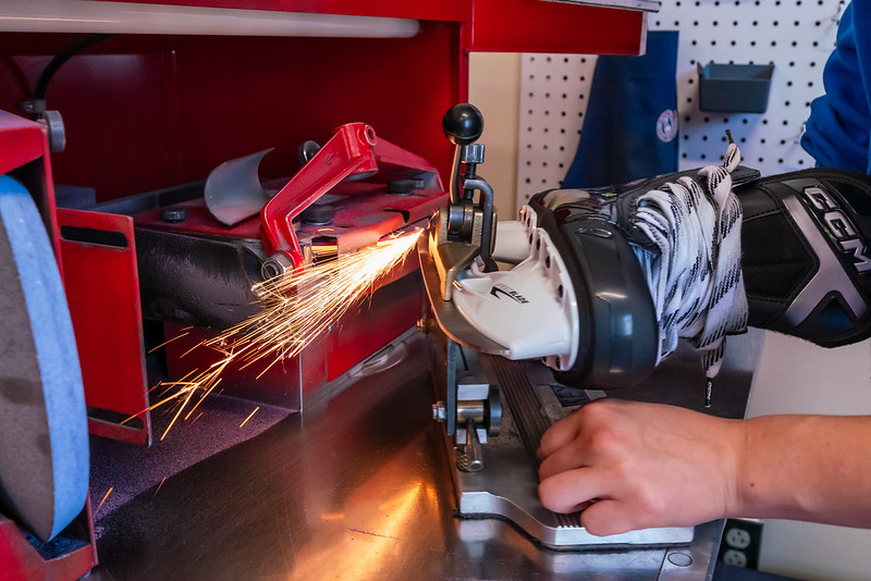 Hockey skate being sharpened