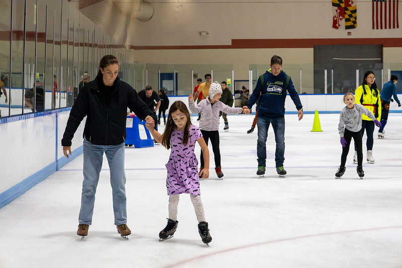 Family ice skating together