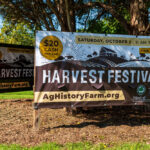 The sign for Harvest Festival at the entrance of the park