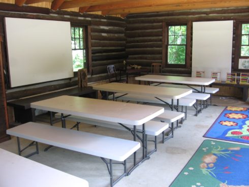 Locust Grove Nature Center Armstrong Log Cabin Interior with rows of tables