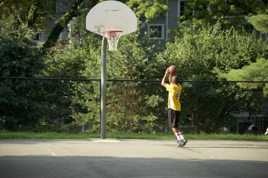 Patron playing Basketball at Chevy Chase Local Park