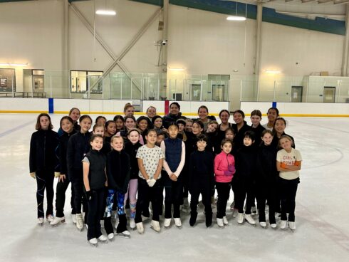 Skaters posing together at the end of the clinic