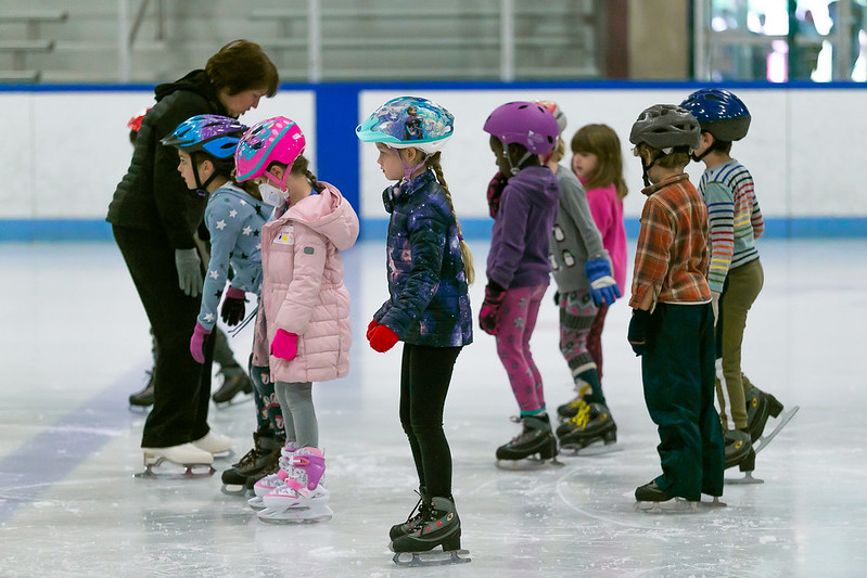 instructor with group of skaters
