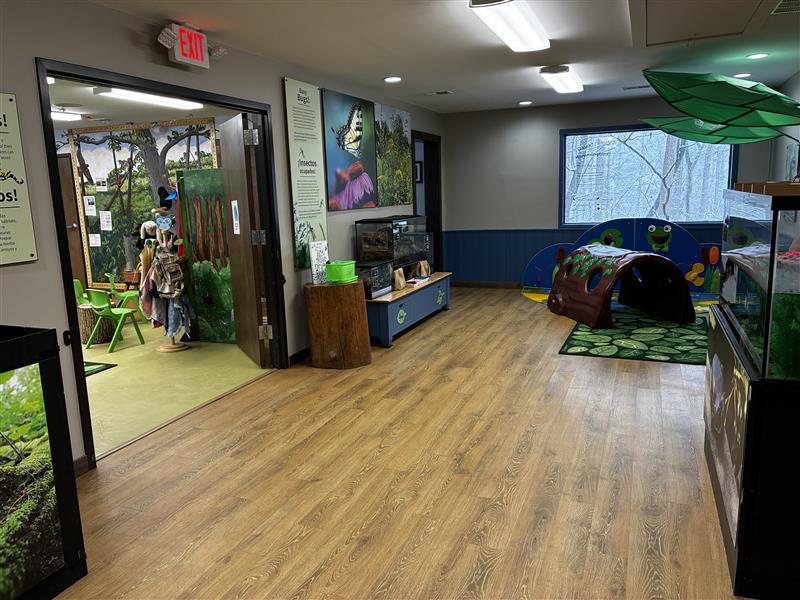 Animal enclosures, information panels and activities inside Brookside Nature Center's exhibit area. 