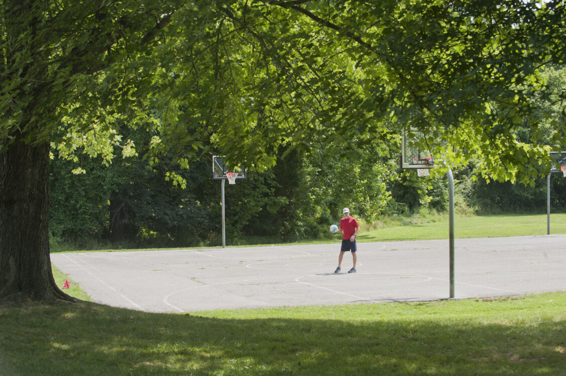 Visitor playing basketball at Randolph Hills Local Park