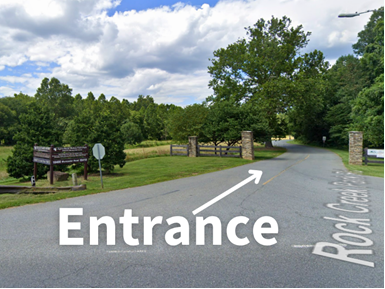 The park entrance from Muncaster rd with an arrow and the word "Entrance" 