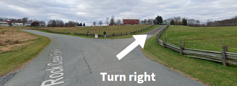 Map view of the road to the historic farmhouse with an arrow and the words "turn right" 