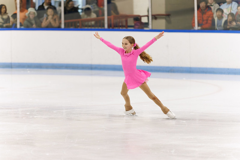 Skater doing a spread eagle at ice show