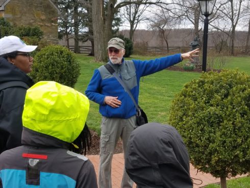 Cultural Interpreter Mike Robinson speaks to a tour group