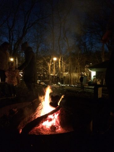 fire pit with a glowing fire after dark at Locust Grove Nature Center