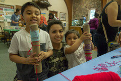 A family displays their crafts.