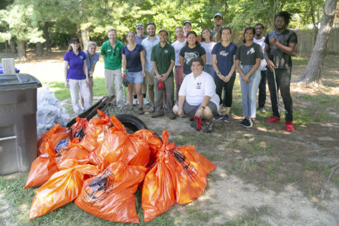 volunteers cleaning up trash in park