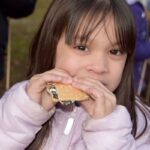 Girl eating S’mores Maydale