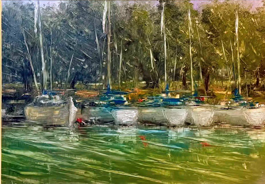 Impressionistic painting of a row of sailboats docked on calm green water beside a wooded shoreline. Tall masts rise into a softly rendered backdrop of trees, while loose brushstrokes and reflected light create a serene, atmospheric harbor scene.