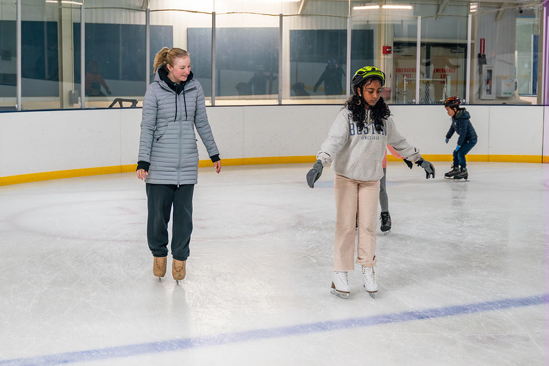 Coach and camper skating