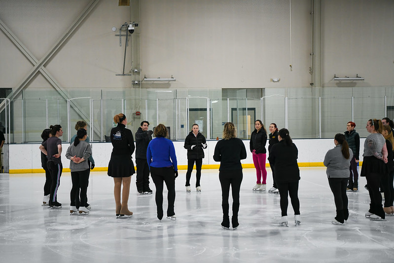 Mariah and Max talking with the adults on the ice