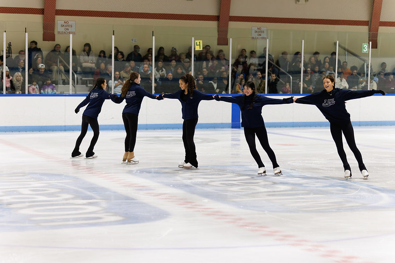 Skaters performing a wheel in the ice show