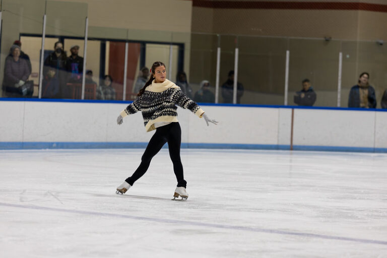 Figure skater performing a spread eagle