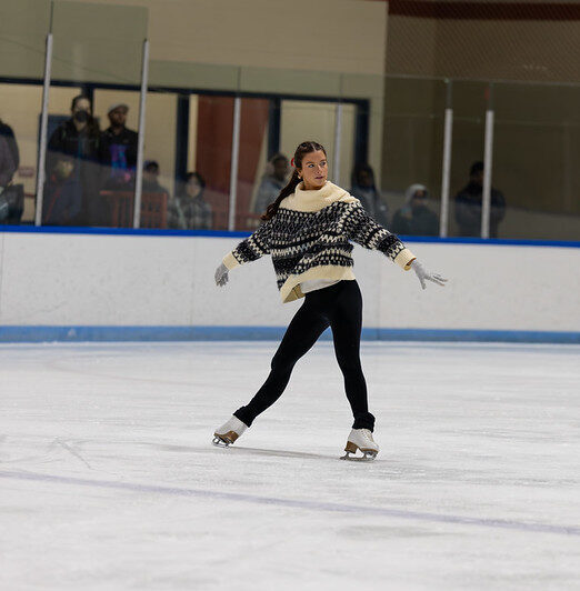 Figure skater performing a spread eagle