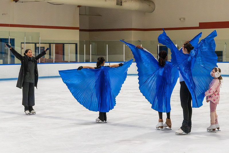 Figure Skaters with blue costume wings