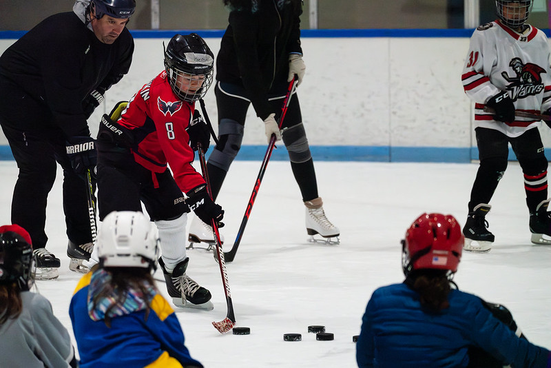 Coaches and skaters at Hockey camp