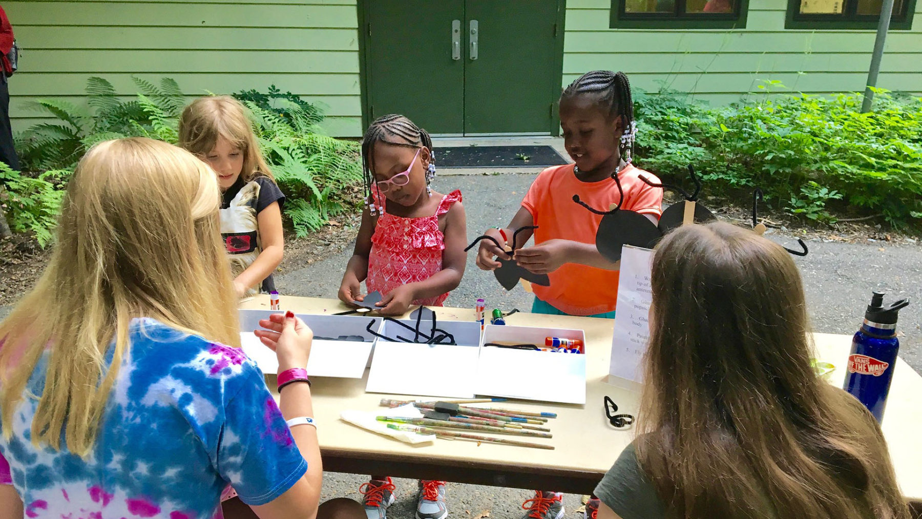 Kids playing and making an art craft at Brookside Nature Center
