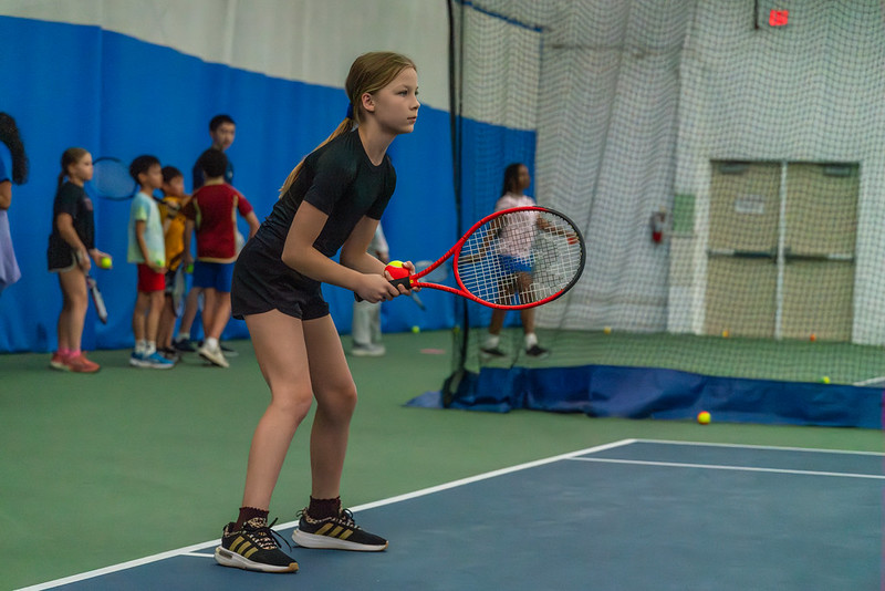Girl waiting to receive a tennis serve