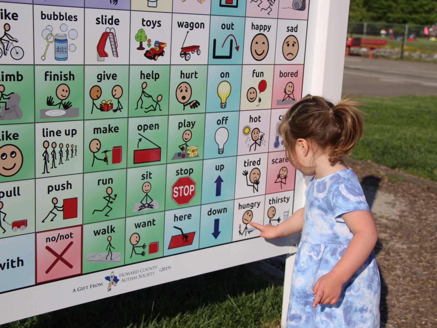 child playing with word board