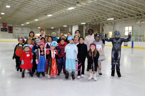 Smile, Sports equipment, Field house, Ice skate, Ice rink, Player, Winter sport, Helmet, Skating, Ice hockey equipment