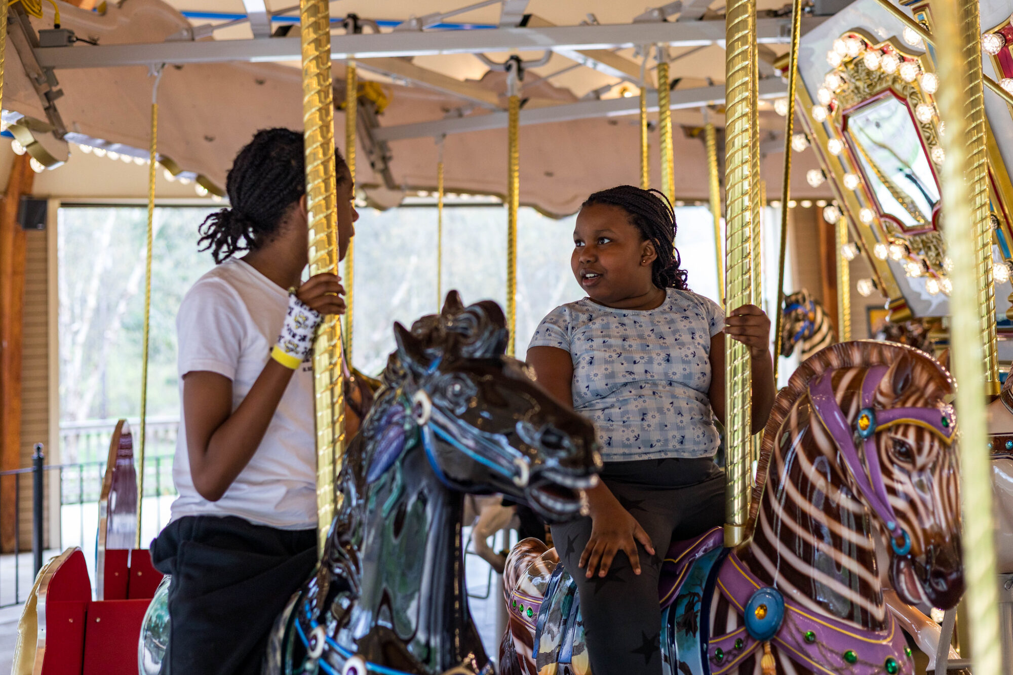 Girls enjoying the carousel