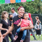 Mother dancing with her baby girl at Salsa in the Park