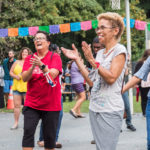 Two women clapping to music at Salsa in the Park