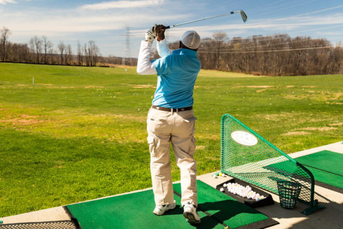 Adult working on his swing at South Germontown Driving Range. 
