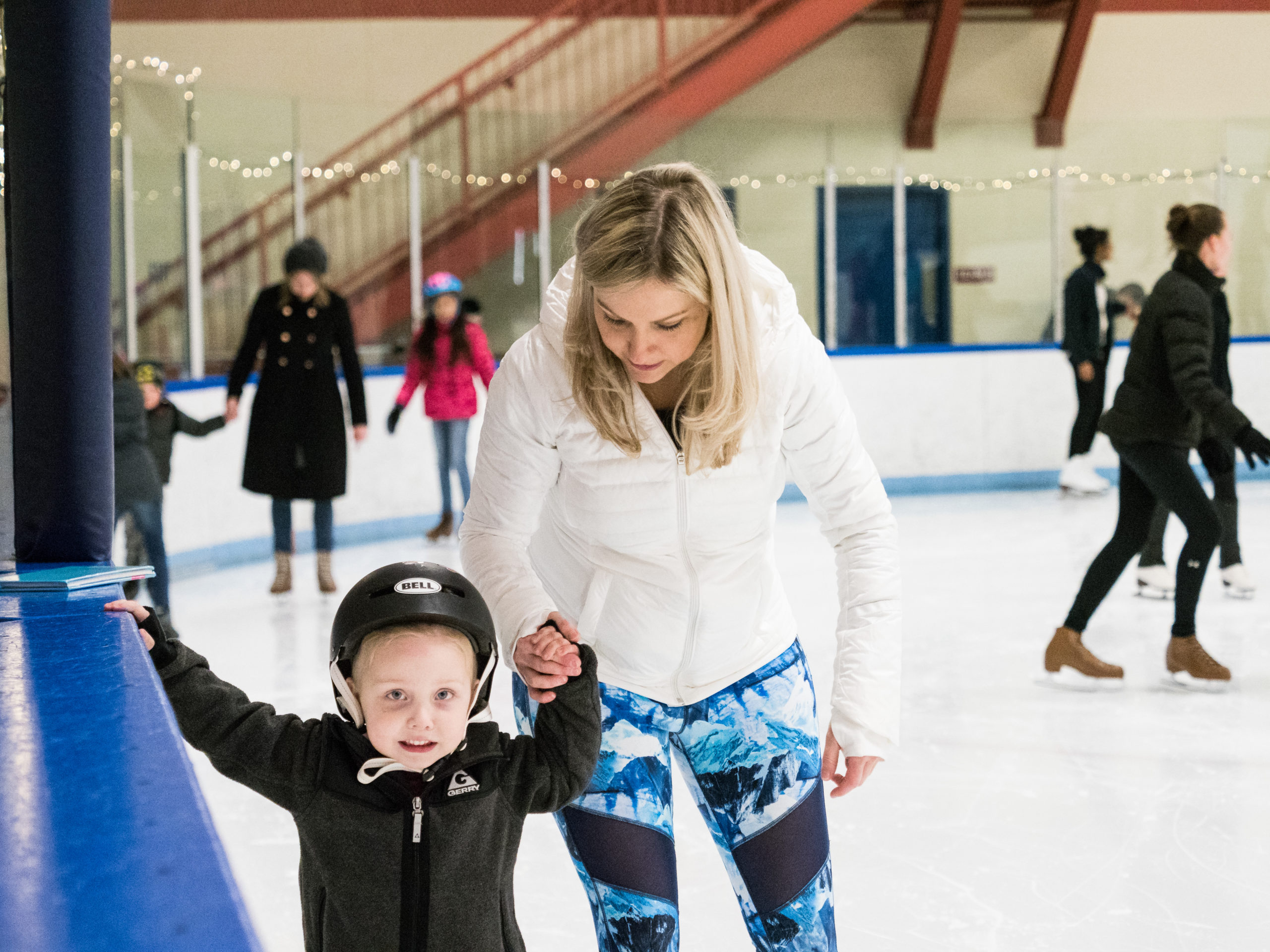 little boy and mother ice skating