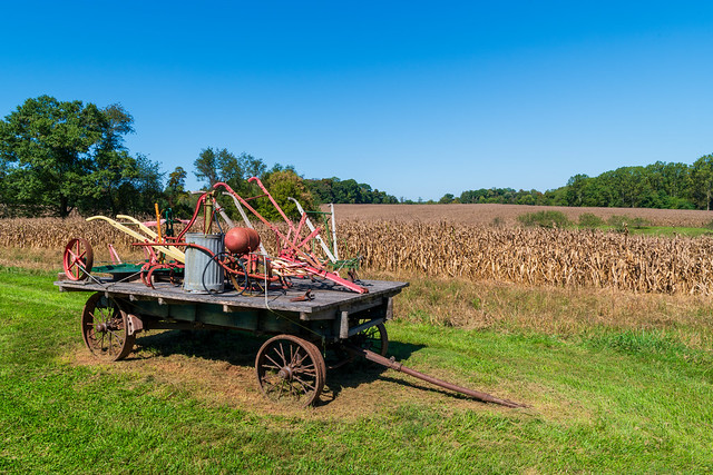 Historic Farming Equipment in front of corn field