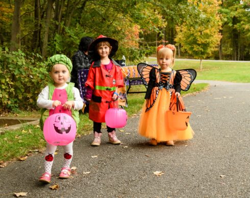 three children dressed in costumes