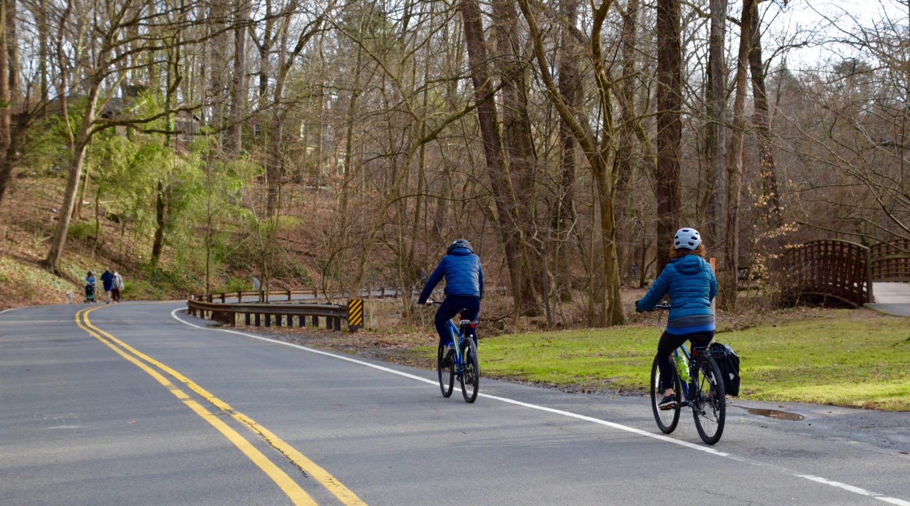 Two cyclists riding bikes on Sligo Creek Parkway.