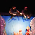 Puppet co puppeteers operating the puppet characters in peter and the wolf