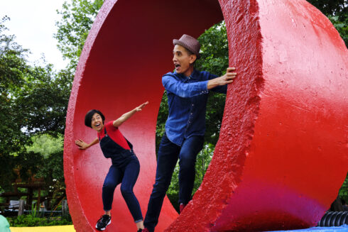 123 andres in dynamic poses on a red sculpture