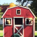 kidsinger jim's barnyard set with animal puppets peeking their heads through the windows
