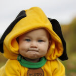 Close up of baby dressed as Pluto